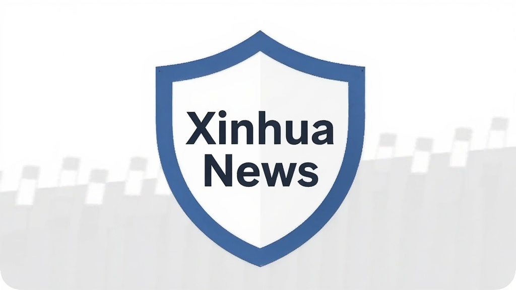 画面展示一个带有盾牌形状的安全认证图标,盾牌中央写着“Xinhua News”,背景是干净的白色与浅灰色,风格极简,主体突出安全与信任感,画质清晰,无多余装饰元素。